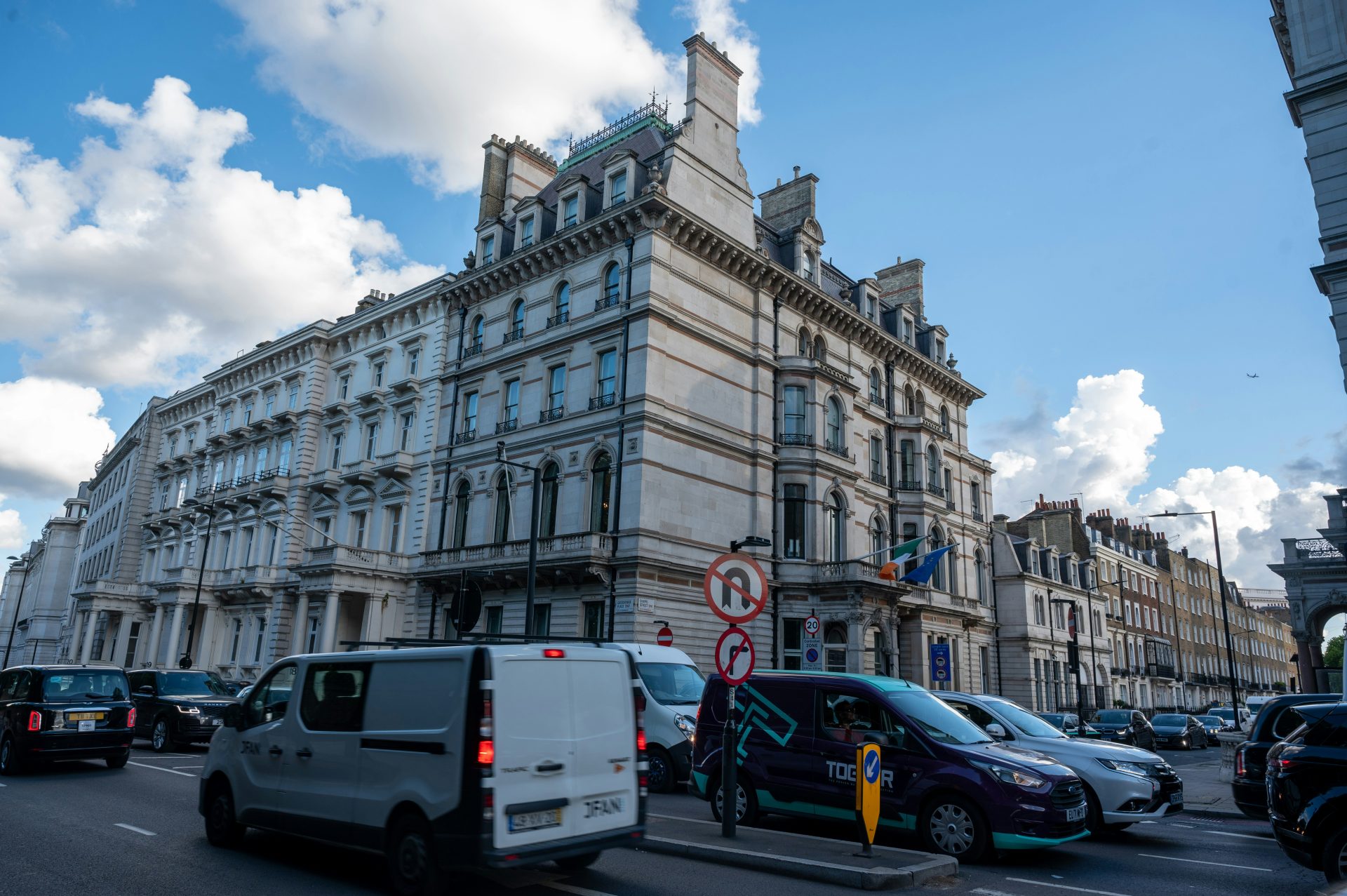 a street with cars and buildings along it